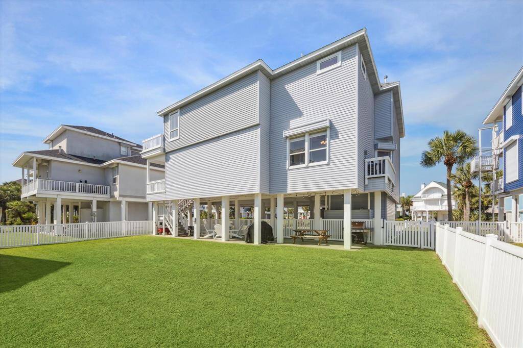 Spacious backyard with plenty of room for kids to play and enjoy.  This space provides ample room for a pool.