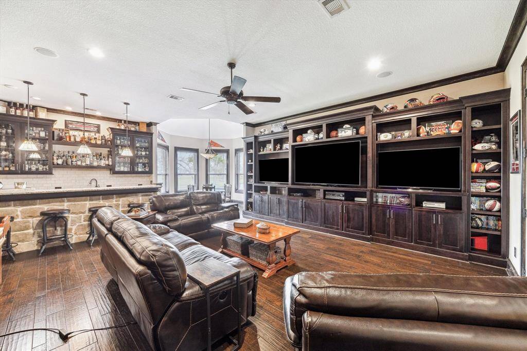 The game room is loaded with built-ins and its very own bar—your new go-to hangout for game nights or movie marathons.