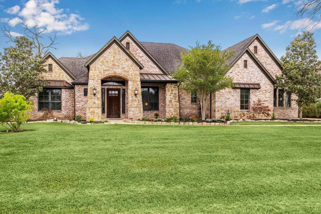 Welcome to your dream retreat in the prestigious gated golf course community of Weston Lakes.