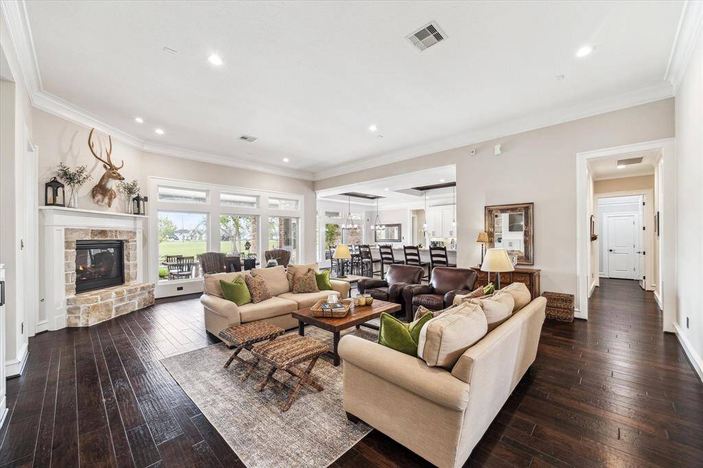 Step inside to an expansive open-concept living area designed for entertaining and everyday luxury.