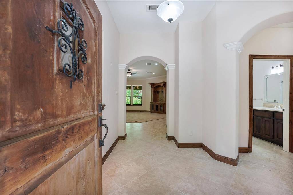 Come on in!  Directly ahead is the main living area.  To the right are secondary bedrooms and a full bathroom.
