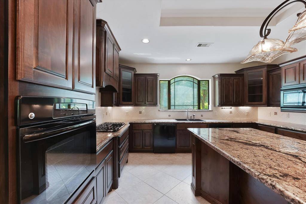 A view of the kitchen showing the beautiful granite counters.