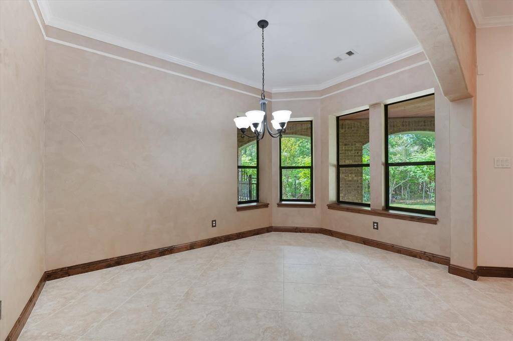 The formal dining area is open to the living area and has plenty of space for a large table, hutch, and other furniture.  Great place for a sit-down meal with family or friends!