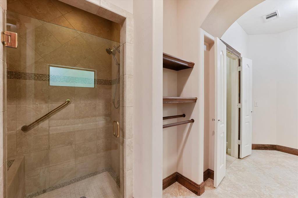 The separate walk-in shower in the primary ensuite is very spacious.