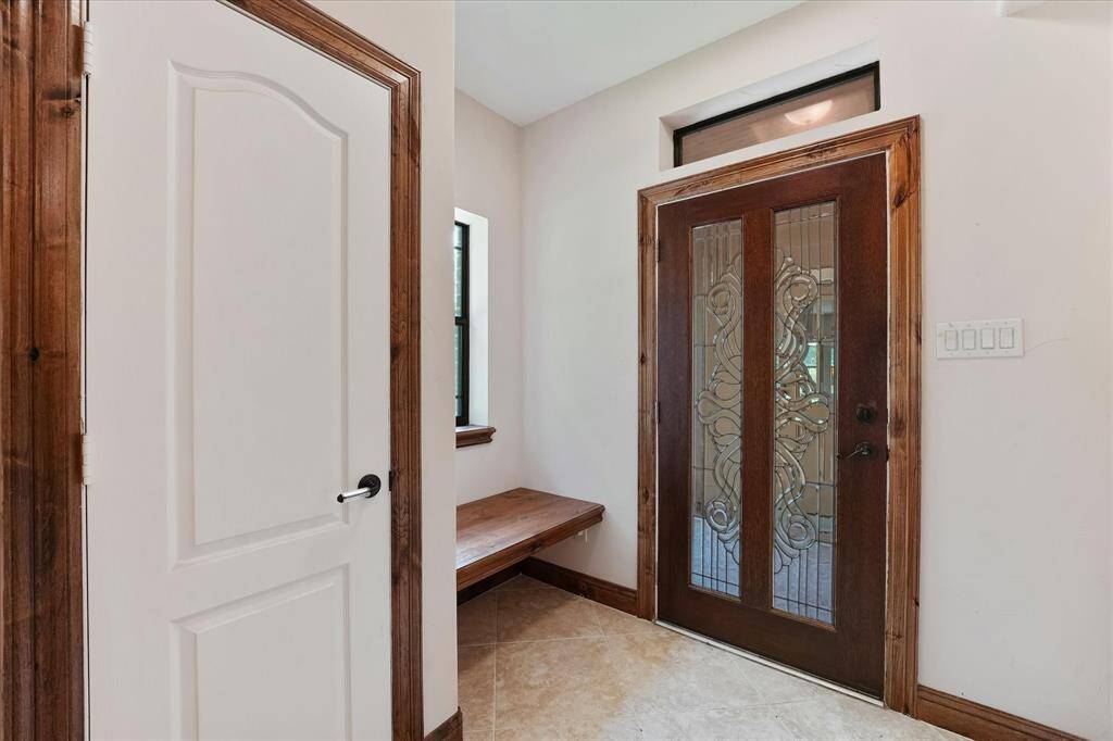 The second front entrance allows the home to be configured as a "mother-in-law" plan, with the second primary suite sectioned from the home for privacy and with its own entrance.