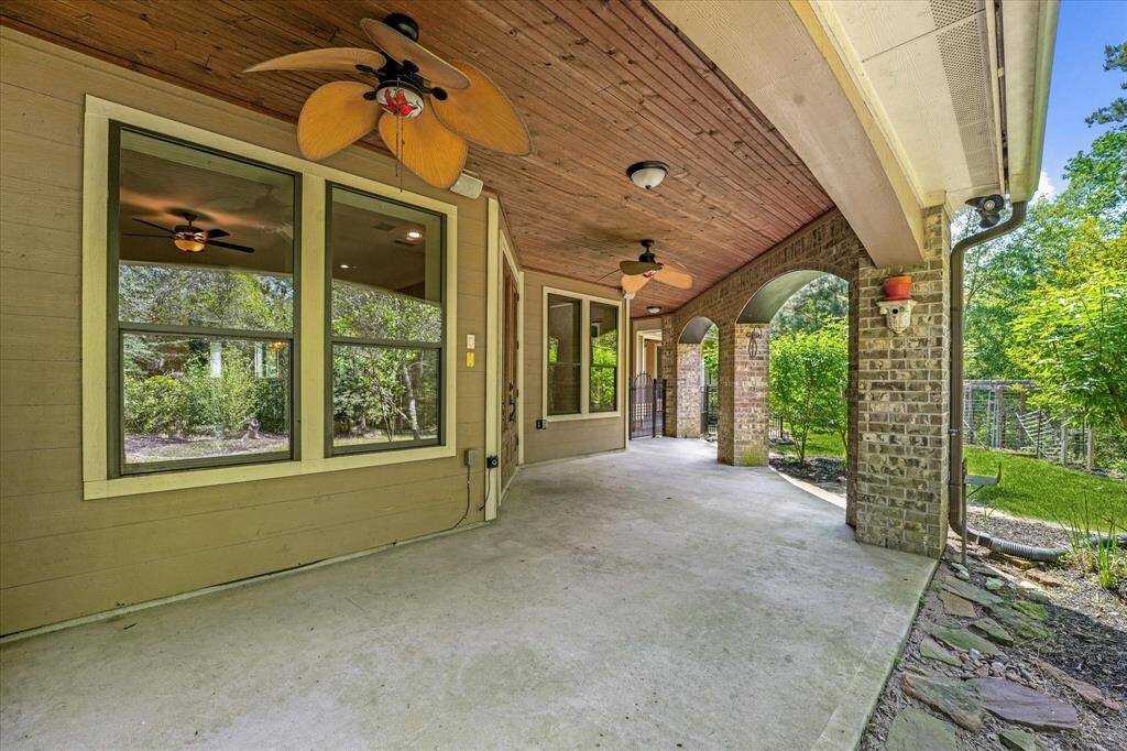 The back patio is huge and looks out on a beautiful wooded area.