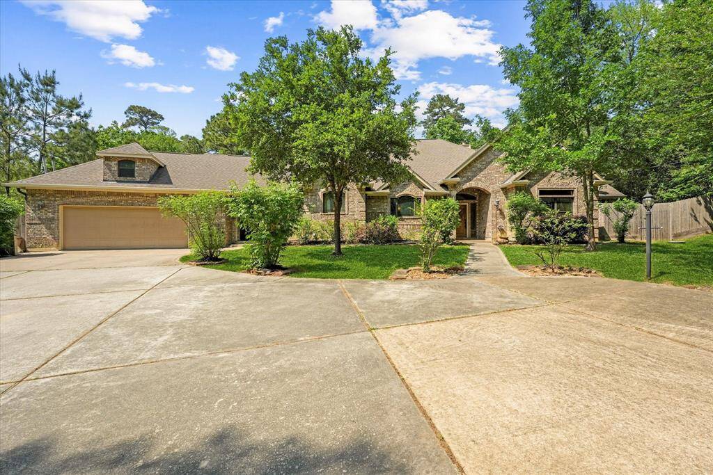 The driveway leading to the home is huge!  Lots of space for parking and to maneuver here.