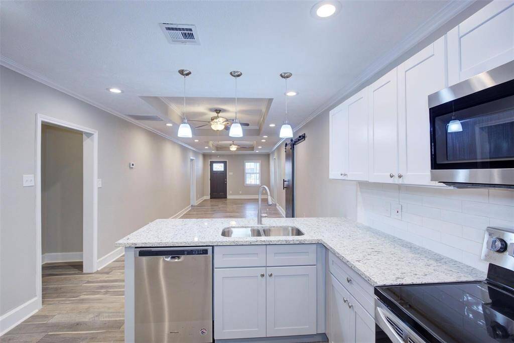 stainless steel dishwasher and gorgeous new stone countertops