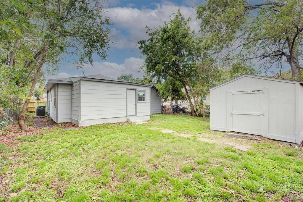 back yard with  large storage shed