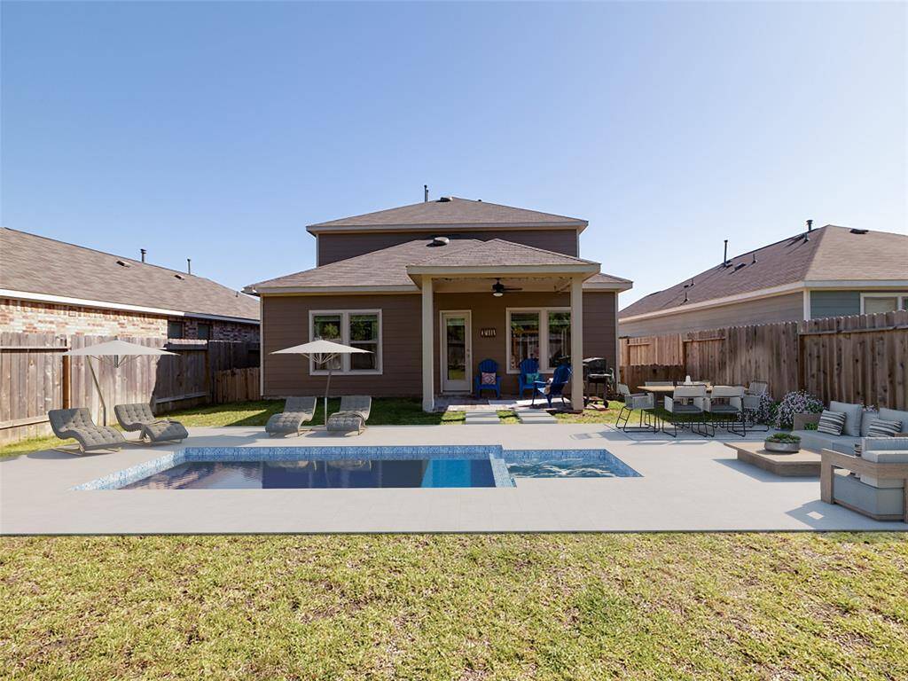 This photo shows a two-story brick home with a double garage. The front yard features a well-maintained lawn and shrubbery, and the driveway offers ample parking space. The exterior is classic and inviting, with a covered entryway.