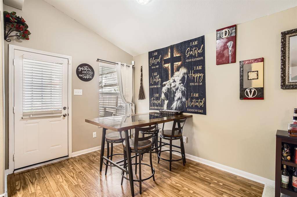 The dining room is open to the family room and right next to the door to back patio