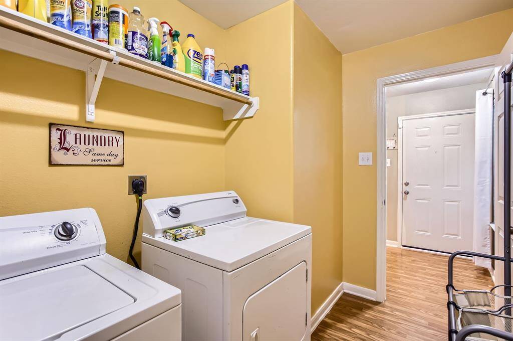 Laundry room with shelving and plenty of space.