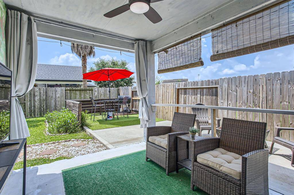 Out back you have a covered patio with ceiling fan.
