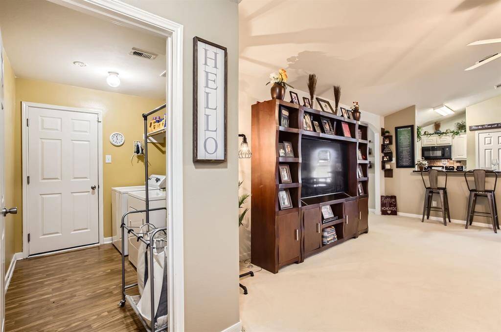 The laundry room is just across from the entry.