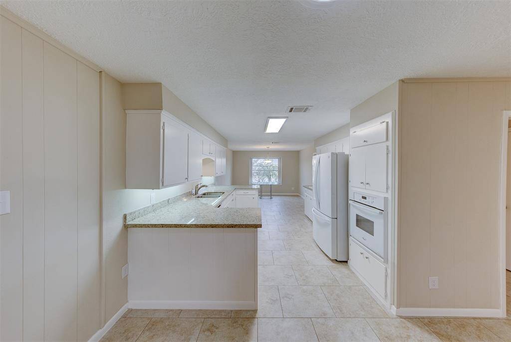 View of the kitchen from the large living room.