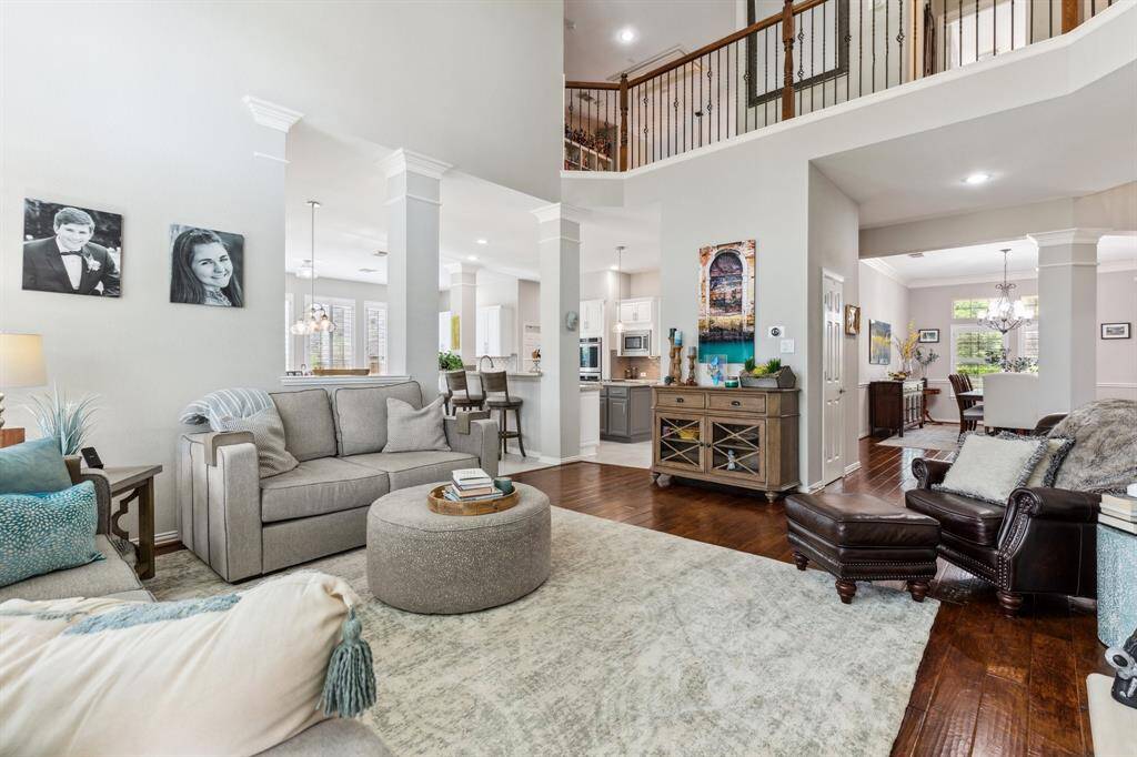The second story open promenade allows for communication with family members upstairs and provides an airy appearance. The subtle paint colors make for a calm environment.