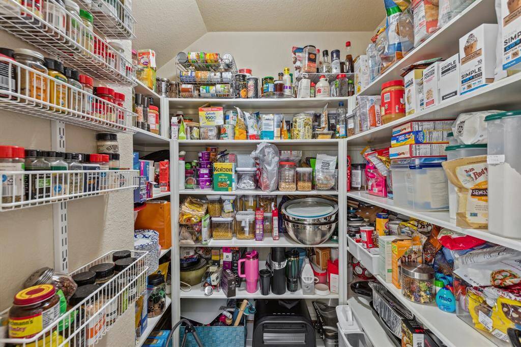 Huge walk-in pantry has tons of storage and allows you to store not only food; but, small appliances.