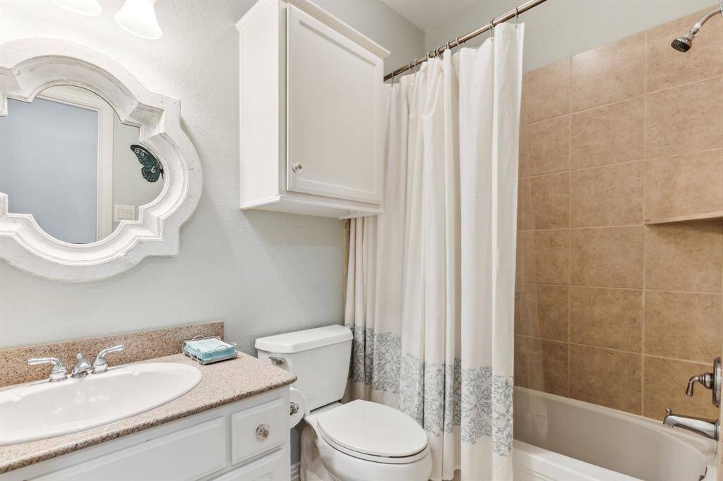 This lovely bath is in the hallway and services the 4th bedroom. Nice granite counter and white cabinetry with combination tub/shower for flexibility.