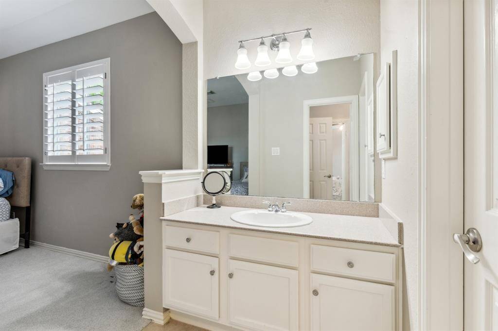 This is the vanity for bedroom 4 with two drawers and three cabinets. Private space for the jack & jill bath. Walk-in closet is to the right.