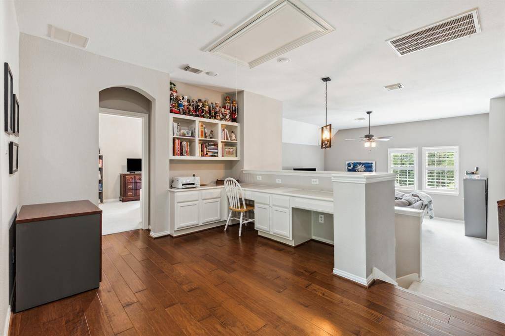 Study nook with two seating niches has wood floors (added by Seller) overlooking the huge game room.