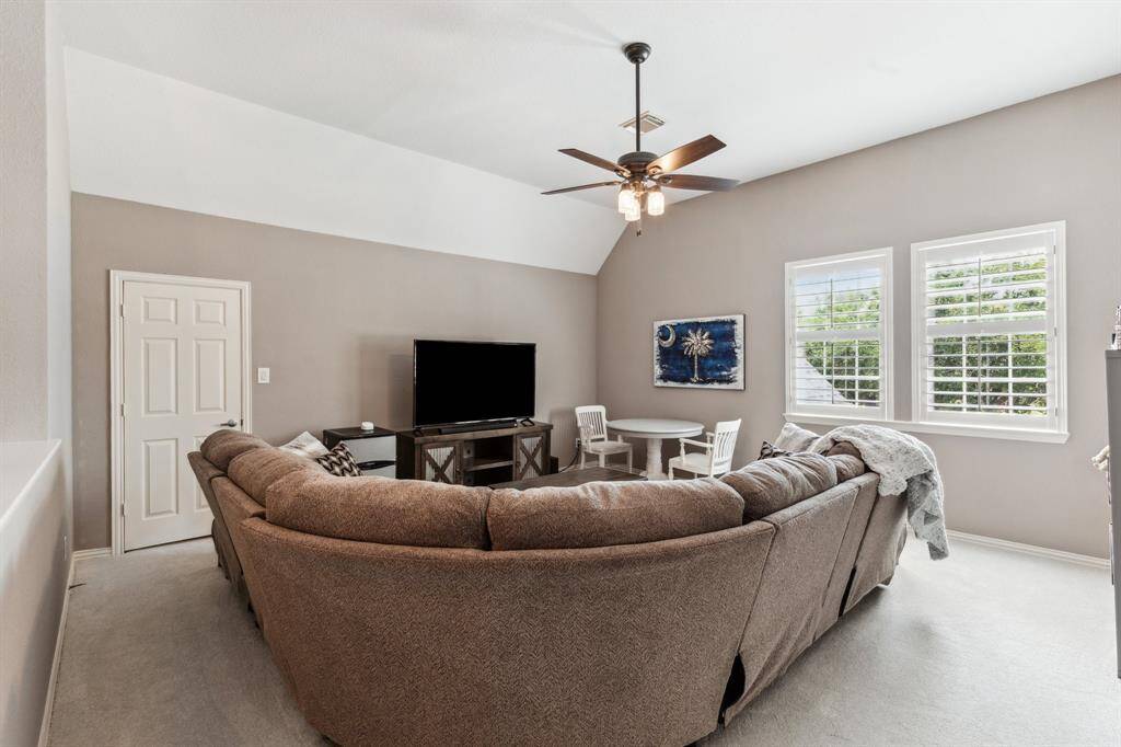 Large game room is spacious enough for a pool table, large sectional or use as a playroom. Plantation shuttered double windows and a very large storage closet. There are two closets in this room. The one not shown is a double doored game closet.