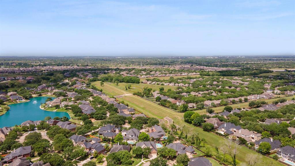 Backs to a green belt.