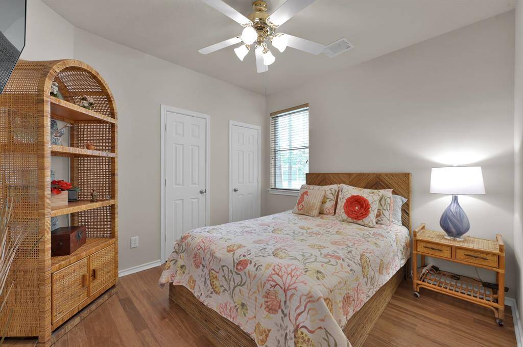 Split plan offers two additional bedrooms with warm bamboo flooring.