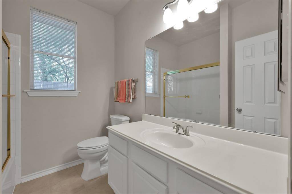 Bedrooms 2 and 3 share this full bath.