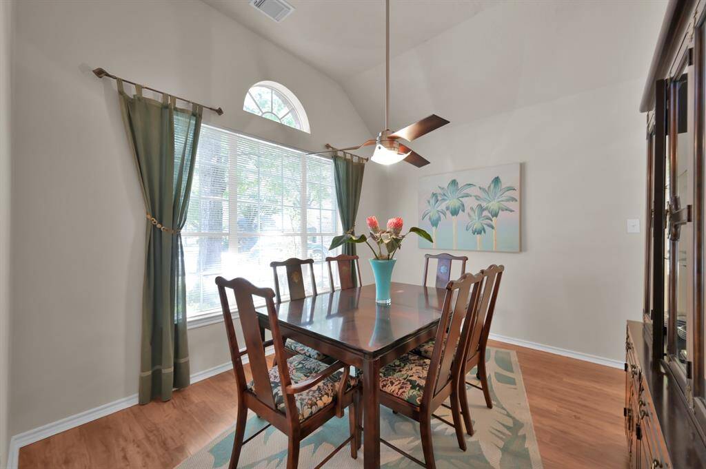 Formal dining can be enjoyed with front yard views.