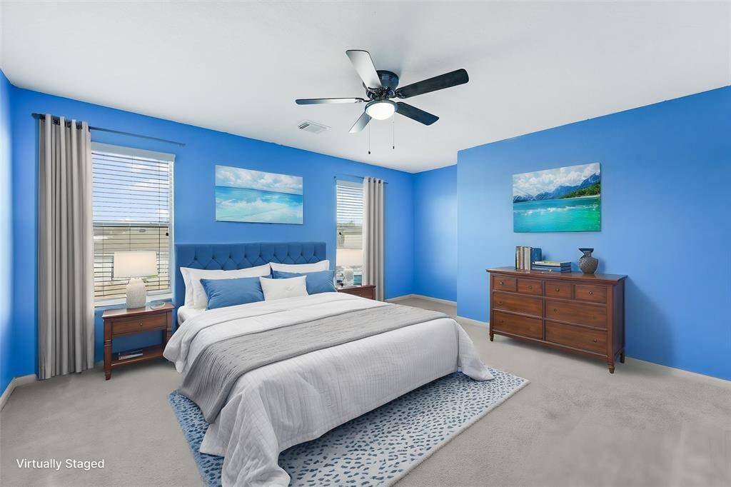 Cheery secondary bedroom facing out to the yard (Virtually Staged)
