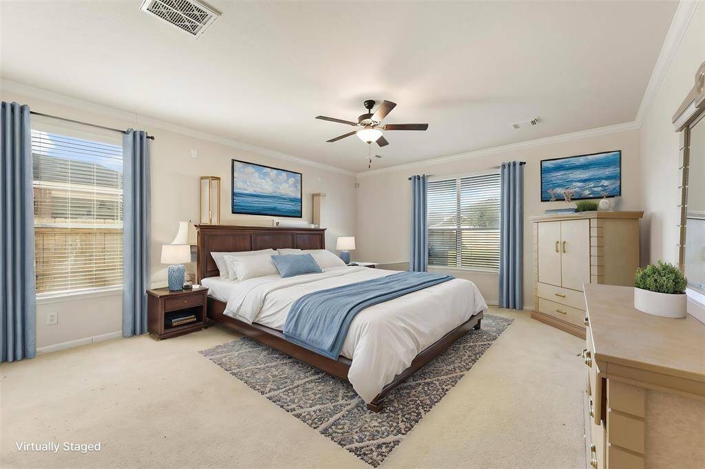 Spacious primary suite with views of the backyard (Virtually Staged)