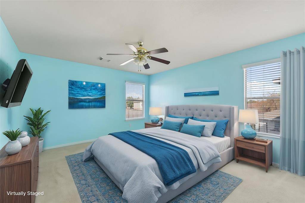 Playful secondary bedroom with French door closet and ensuite bathroom (Virtually Staged)