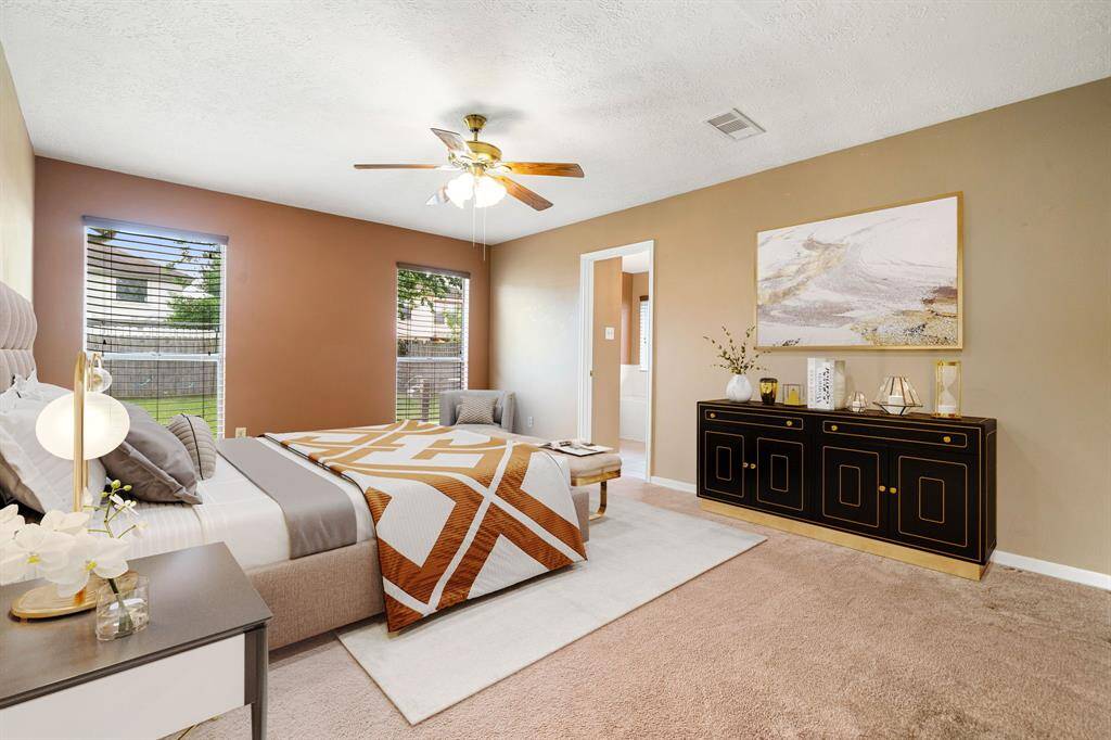 What a wonderful place to come home to, this stunning primary suite greets you with warm custom paint, high ceiling, ceiling fan with lighting, lovely windows with blinds allowing in natural light brightening up this spacious primary bedroom, with extra space for a seating area. *Virtually Staged