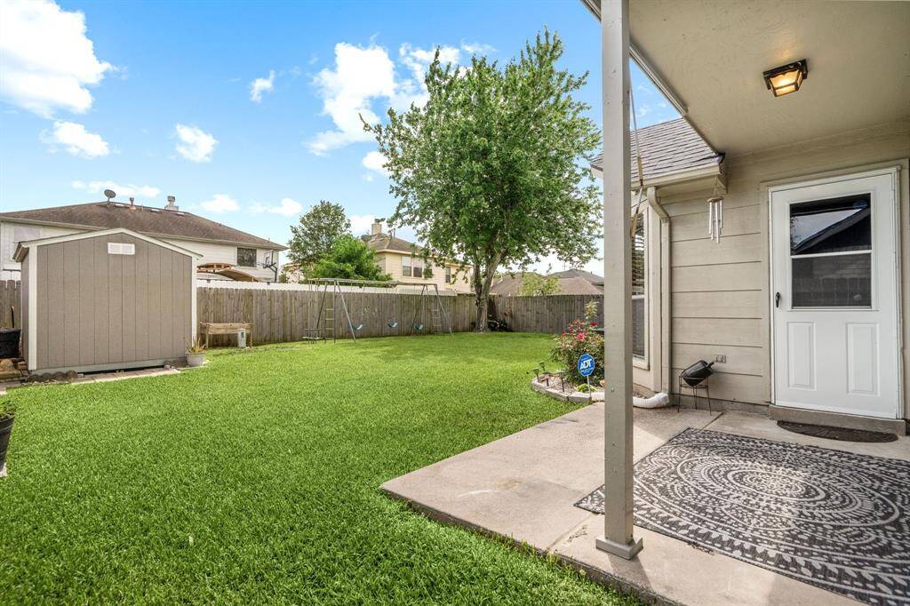 Come and see this spacious backyard with its beautiful covered patio and paved walkway down the side yard. There is plenty of room for the kids to play and adults to relax! Perfect for your outdoor living space, patio furniture, bbq pit, and so much more. The possibilities are endless!