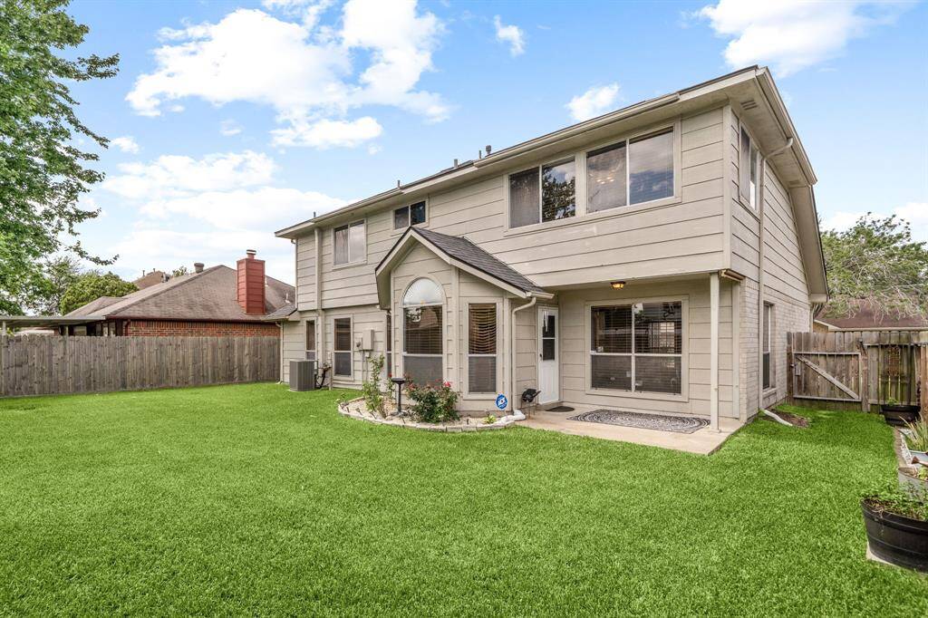 Lush green and spacious backyard, perfect for entertaining and relaxing.