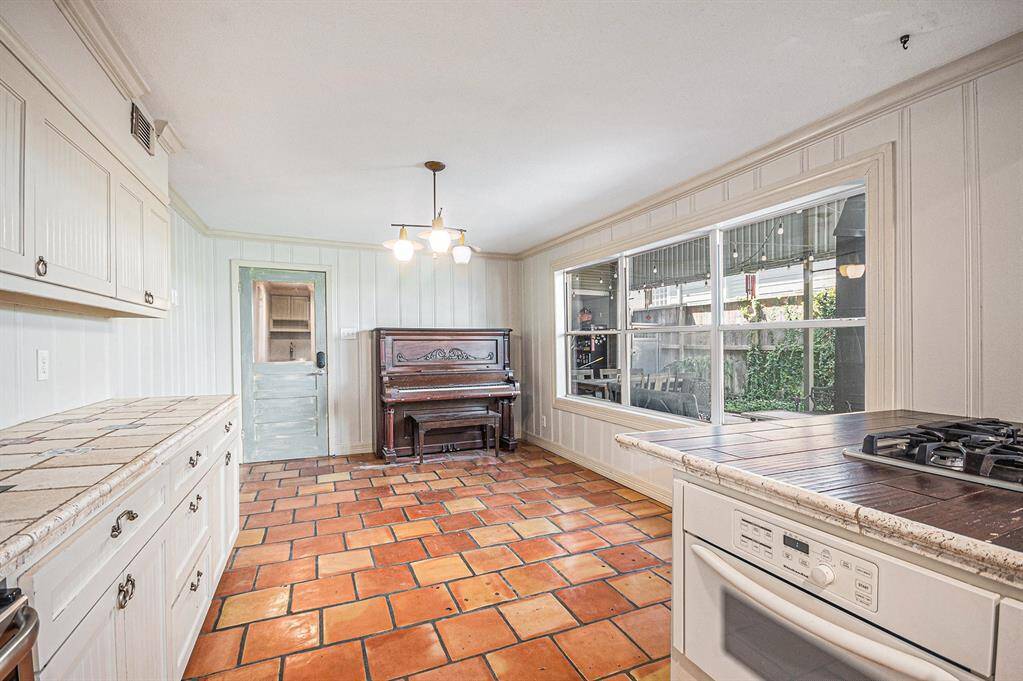 Saltillo Tile Flooring and Travertine Countertops