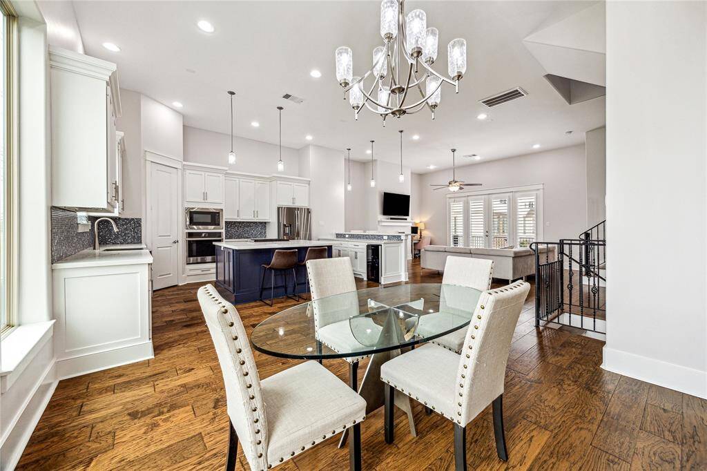 The spacious formal dining area is perfectly positioned between the kitchen and living spaces, creating an effortless flow for entertaining. With its open layout and abundant natural light, it offers the ideal setting for hosting gatherings both casual and refined.