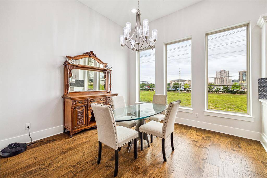 Large windows add an elevated ambiance to every meal — whether you're hosting a dinner party or enjoying a quiet night in.
