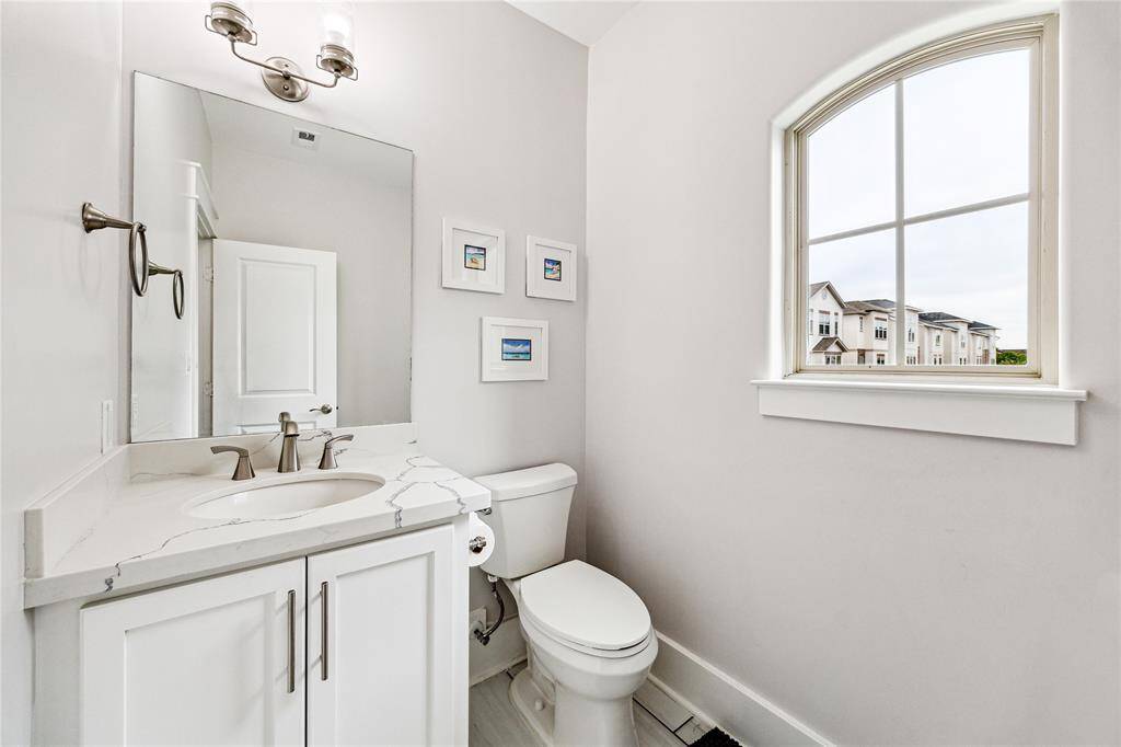Located on the second level, the well-appointed powder room is perfectly positioned for guests.