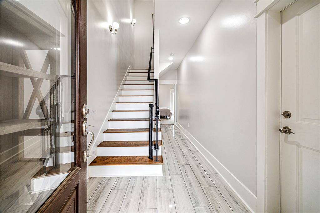 Welcome home! Step into a spacious entryway with an ensuite bedroom on the first floor and direct access to the gated backyard—part of a thoughtfully designed floor plan that blends comfort and functionality.