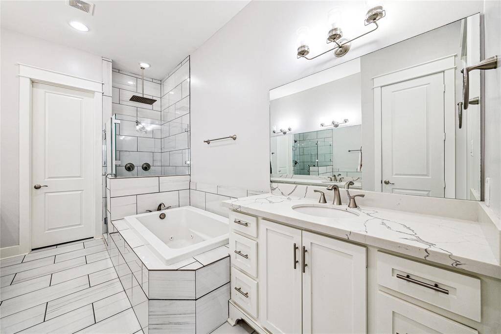 The bathroom also includes a private water closet for added privacy, along with a large walk-in closet, providing ample storage and space for all your wardrobe essentials.