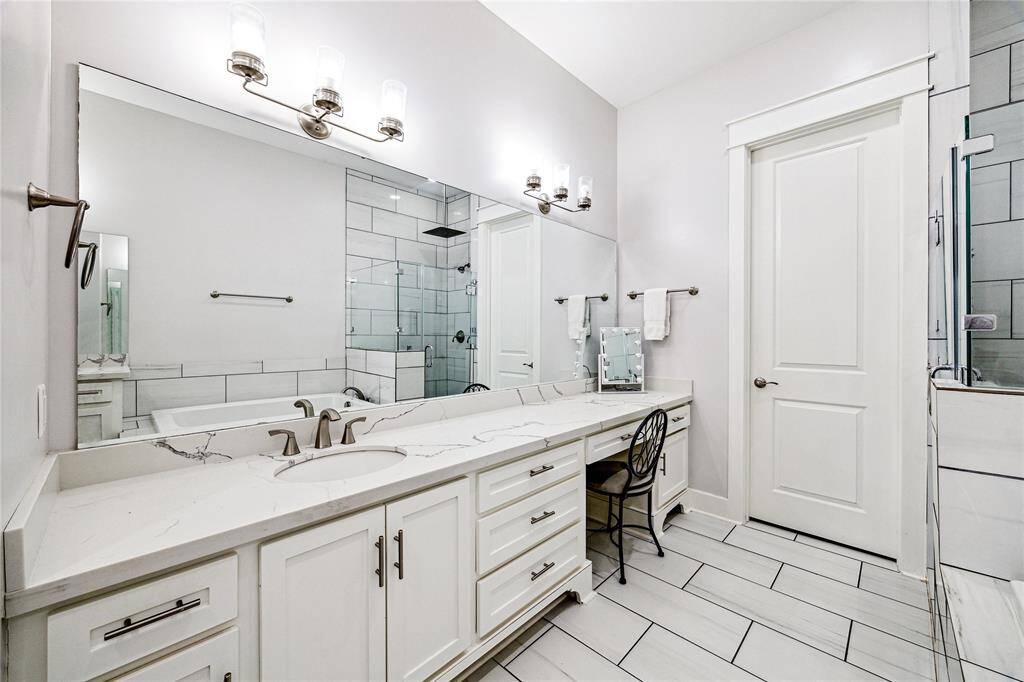 A generous vanity area offers extra space for getting ready.