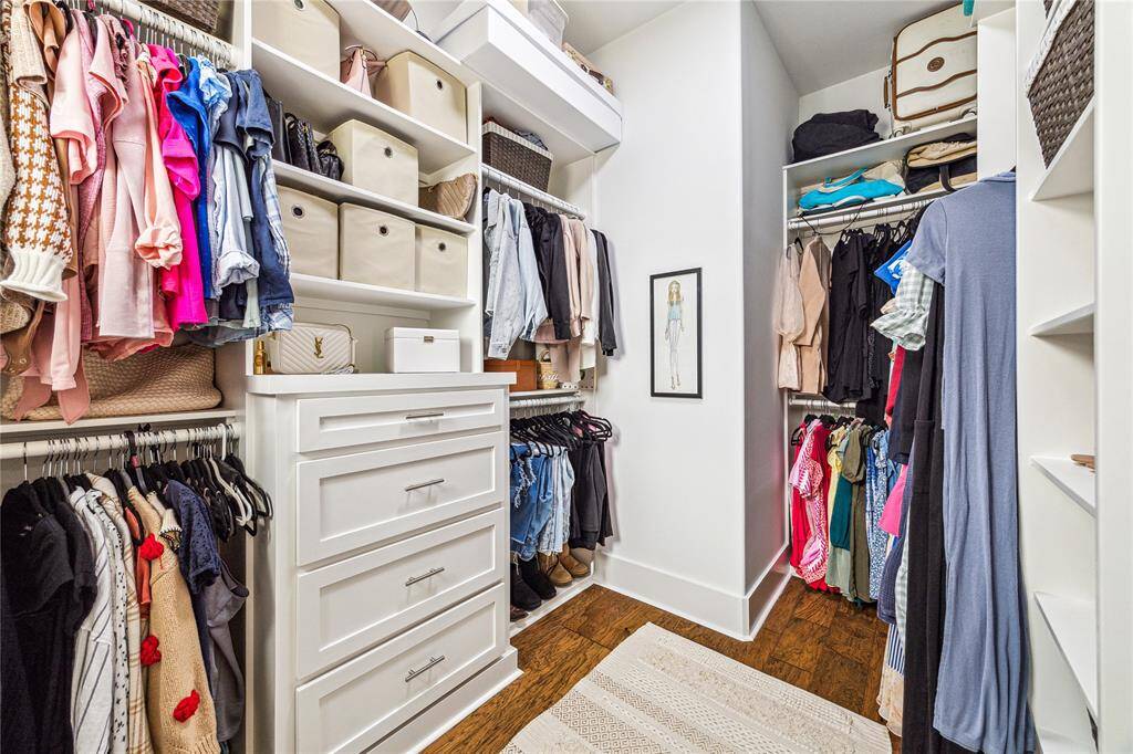 The large walk-in closet is a true highlight, featuring custom built-ins that maximize storage space and offer a place for everything. With plenty of hanging space and additional shelving, this well-organized closet ensures that your wardrobe is always neatly arranged and easily accessible.