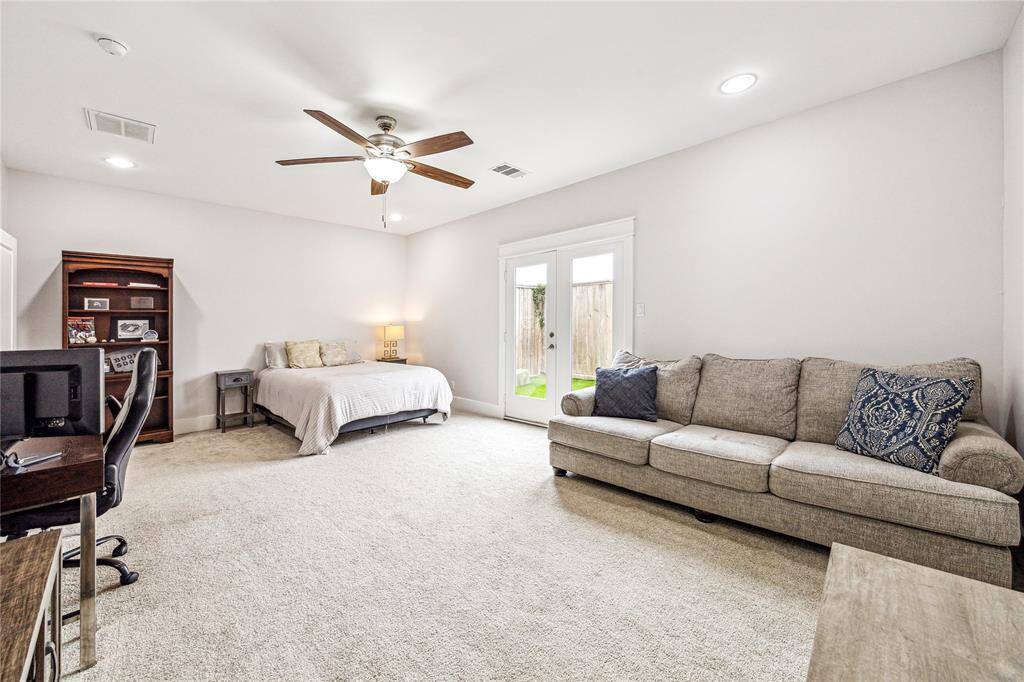 Spacious first-floor bedroom featuring a private bathroom.