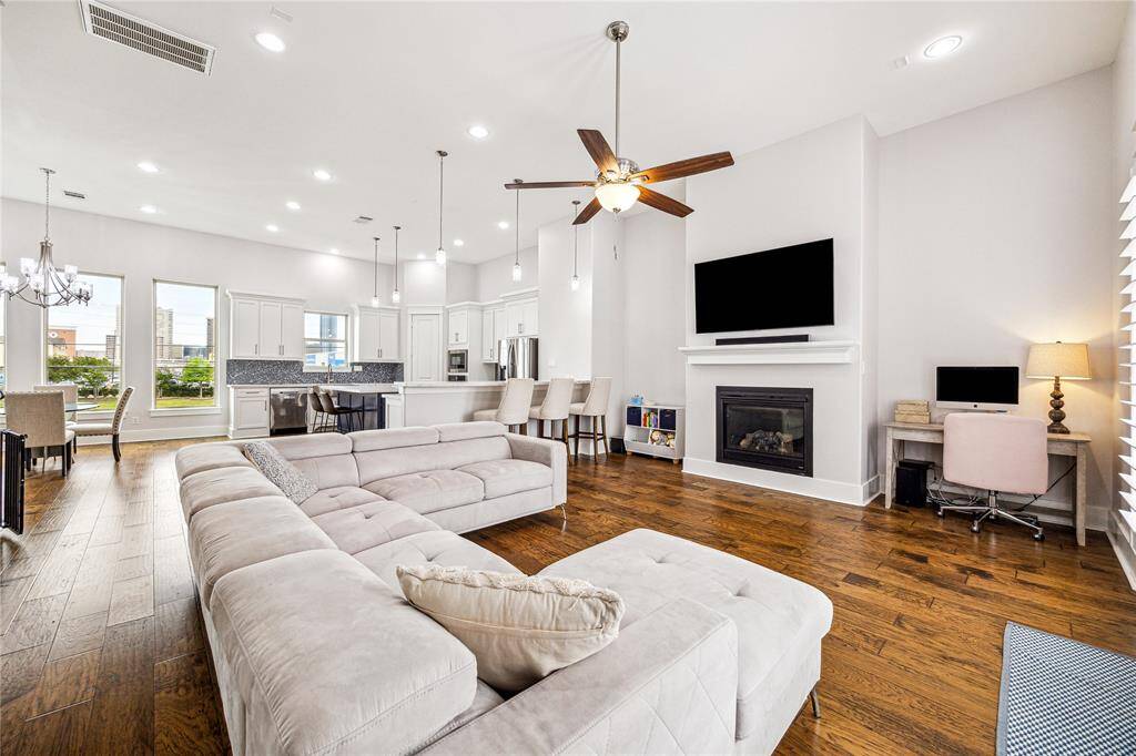 This spacious open-concept floor sits on the second level and seamlessly connects the kitchen, dining, and living areas — ideal for both everyday living and entertaining.
