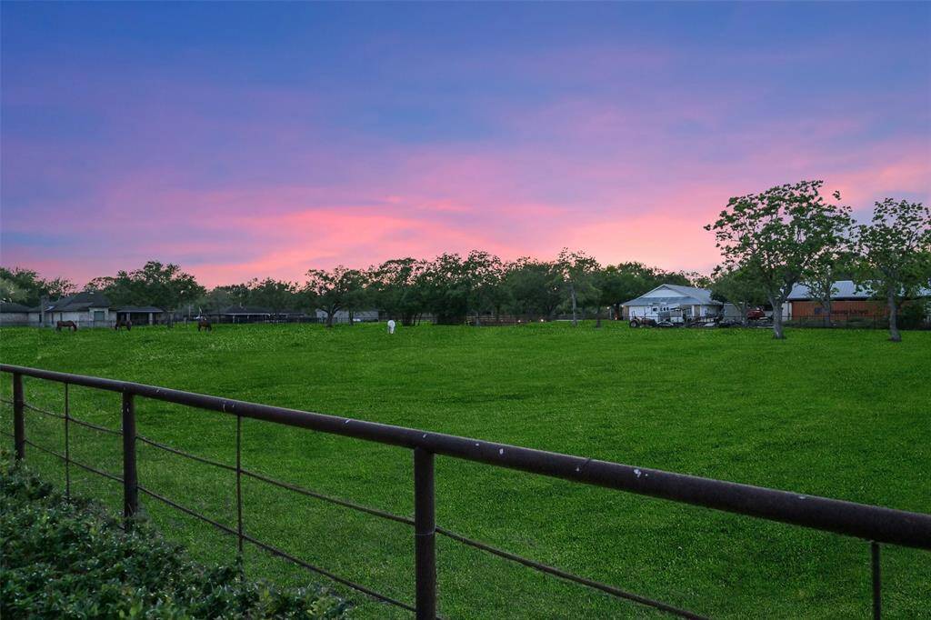 Spacious property bordering with a lush green field and scenic sunset views. Ideal for a tranquil environment right in your backyard.