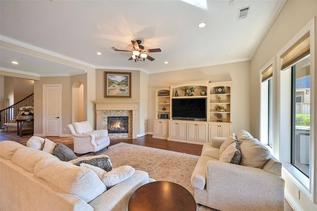 This spacious living room is open to the stunning kitchen, perfect for relaxation and entertaining.