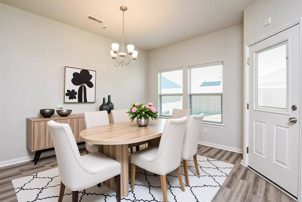 Large Dining/Breakfast area convenient to the kitchen *Digitally Staged Photo*