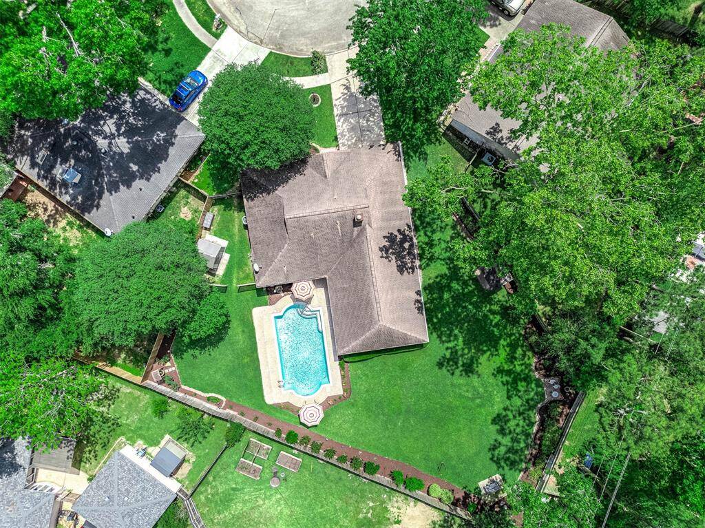 Situated on an oversized lot out of the flood zone in Friendswood.