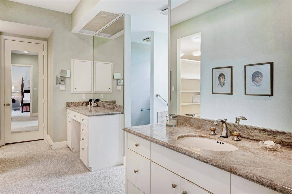 The primary bath has plenty of vanity space.  Unseen is a double walk in closet and dressing area.